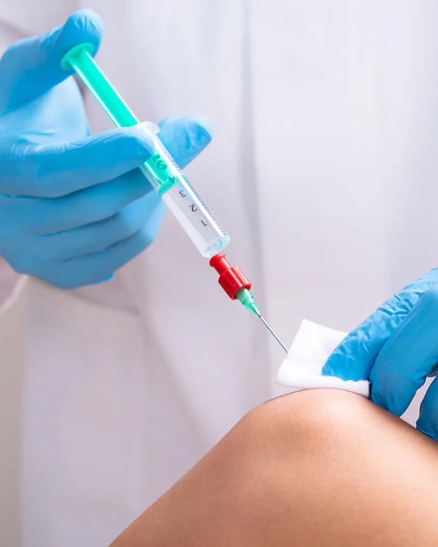 A prolotherapy injection being placed at the knee